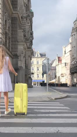 beautiful female tourist walking through the beautiful streets of paris, france. tourism and travel in europe, historical architecture of museums and art galleries