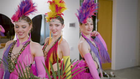 beautiful dancers in colorful outfits are surprised getting ready and show their moves for the camera