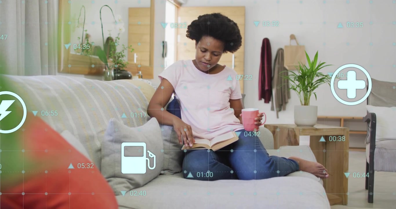 Young Black Woman Reading Book and Drinking Coffee on Couch with Digital Overlays