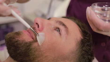 man getting facial treatment