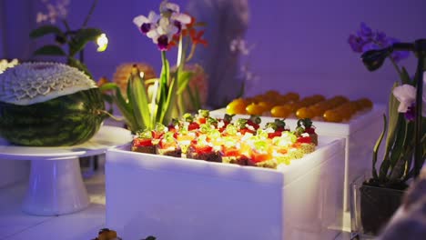 mouthwatering display of small pastries on a white table - a delectable treat for those with a sweet tooth