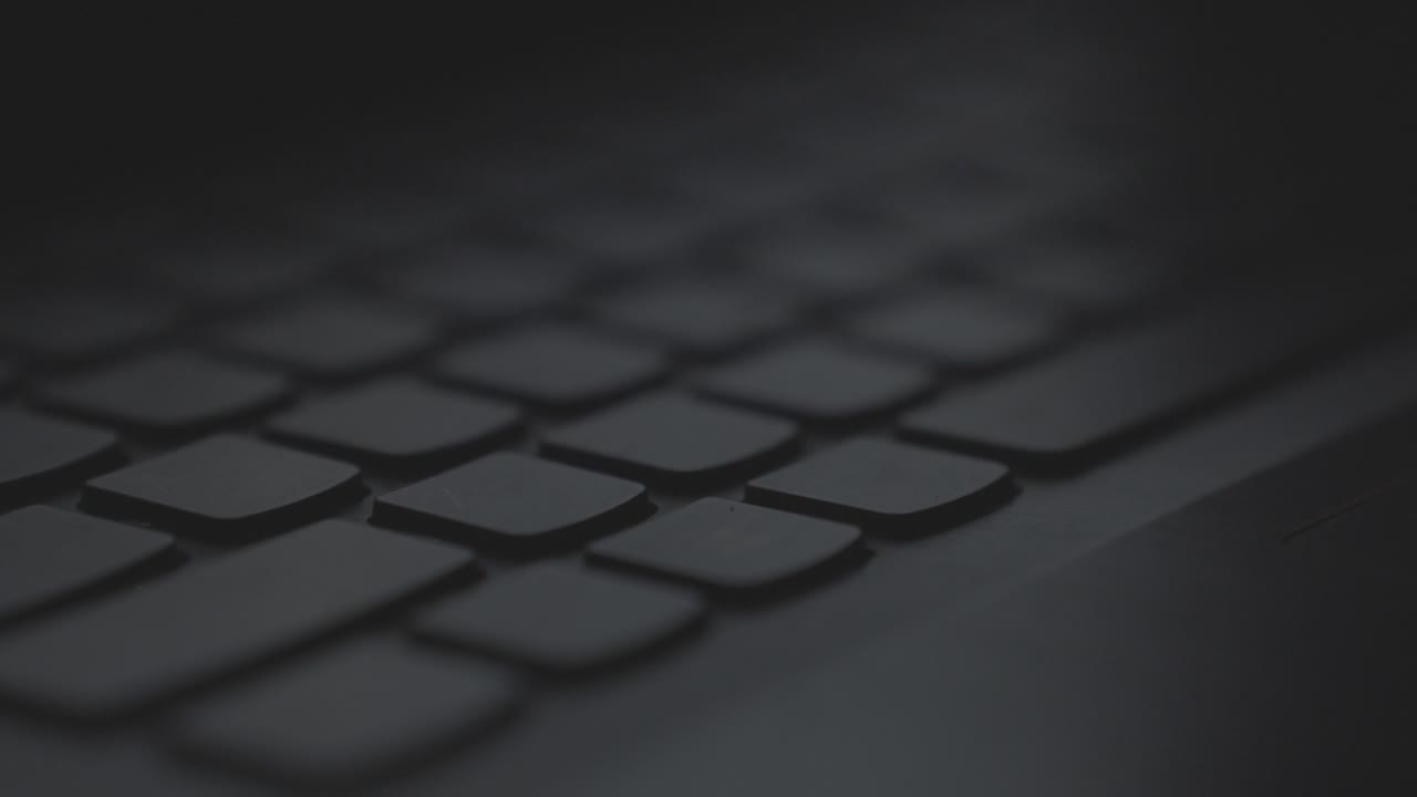 Black keyboard in a close up with a focus pull