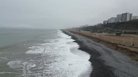 Aerial-dolly-shot-of-the-beach-in-miraflores