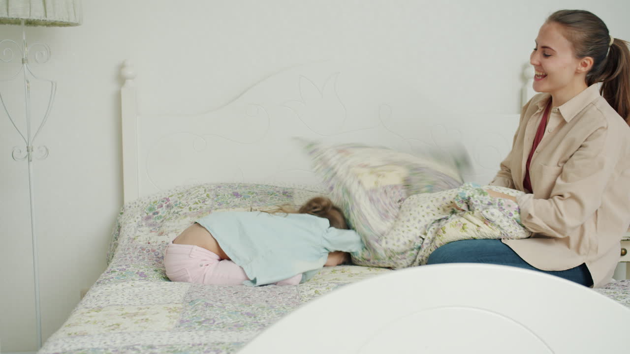 Mother and Daughter Pillow Fight