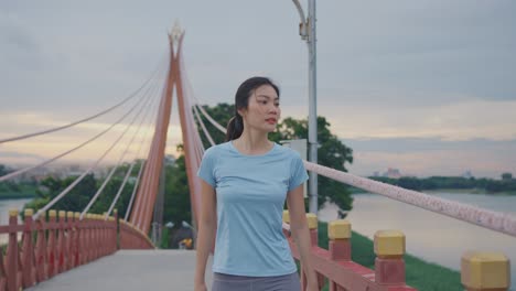 woman exercising on a bridge