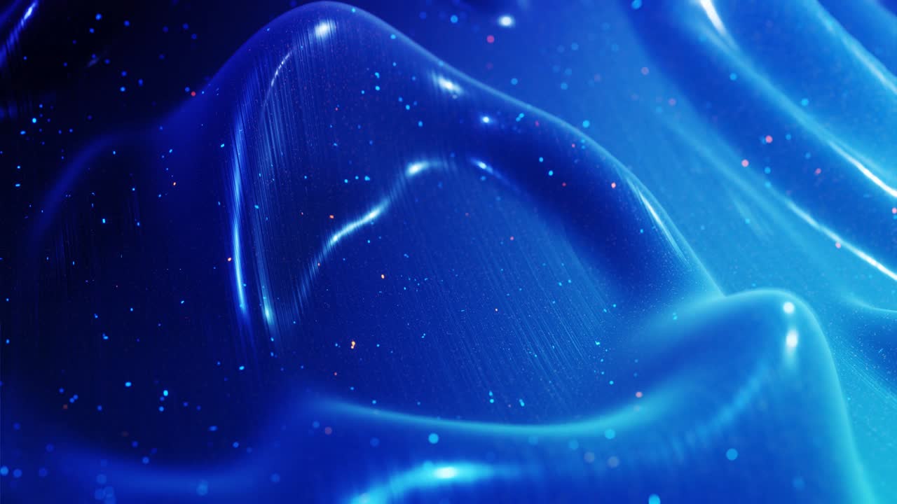 fantastical festive blue bg. Stylish abstract looped background, waves move on glossy surface like landscape made of liquid blue wax with sparkles. Beautiful soft background with smooth animation 4k