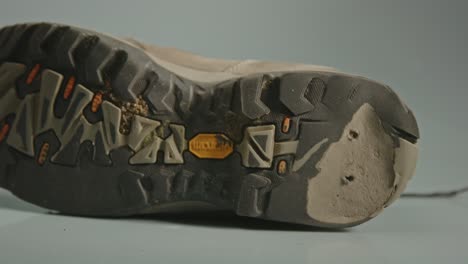 dolly in of damages shoe sole with a worn heel of hiking boot