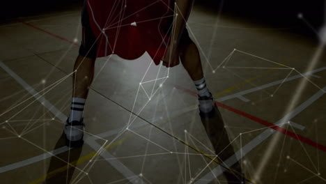 animation of networks of connections over biracial male basketball player at gym