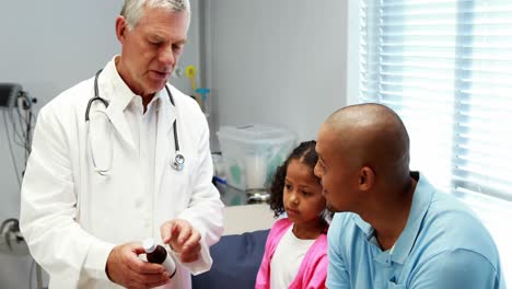 male doctor prescribing medicine to patient