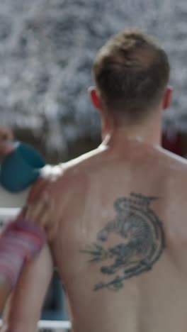 muay thai fighter cooling down with tattoo