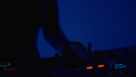 dj mixing music at a night club