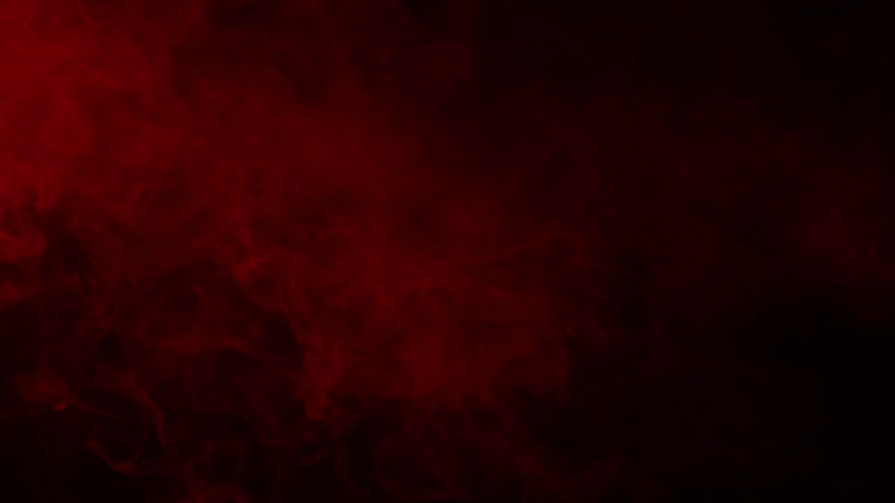 Red mist and blood swirls and flows slowly on a black background. Ideal overlay for bloody horror films, dramatic intros, atmosphere of danger or passion