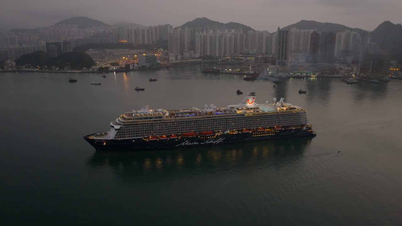 Smoke coming from the funnel of a luxury cruise ship arrivingin Hong Kong