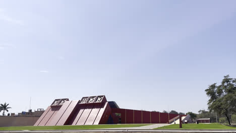 long shot of the facade of the famous peruvian archaeological center "la casa del señor de sipán" in chiclayo, lambayeque during the day