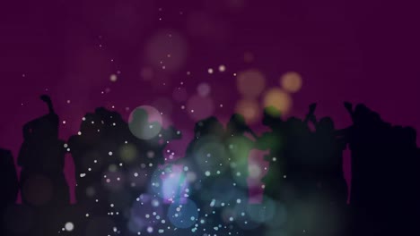 Animation-of-blue-and-yellow-spots-of-light-over-dancing-crowd-with-pink-background