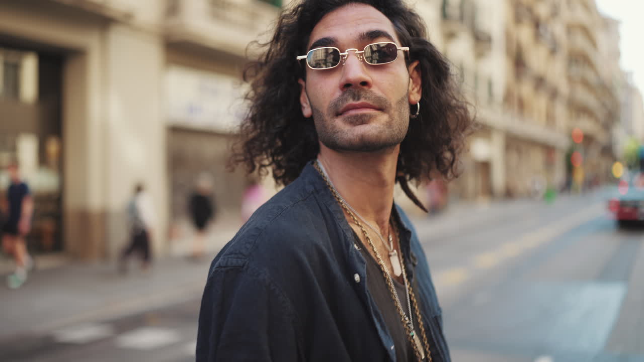Man with Curly Hair on City Street