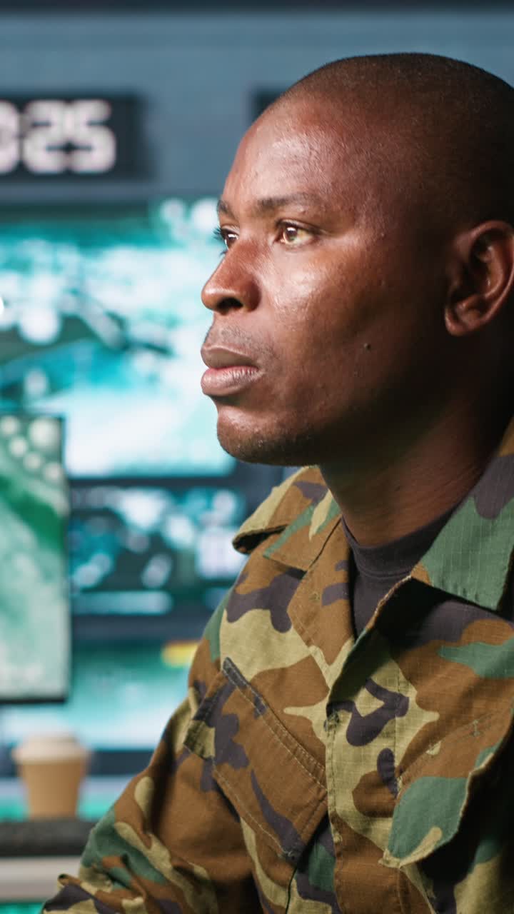 Vertical video Intelligence operative in military base doing surveillance with radar