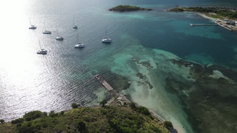 Aerial-descending-to-sailboats-in-the-harbor-near-Foxy's-Taboo-in-the-British-Virgin-Islands