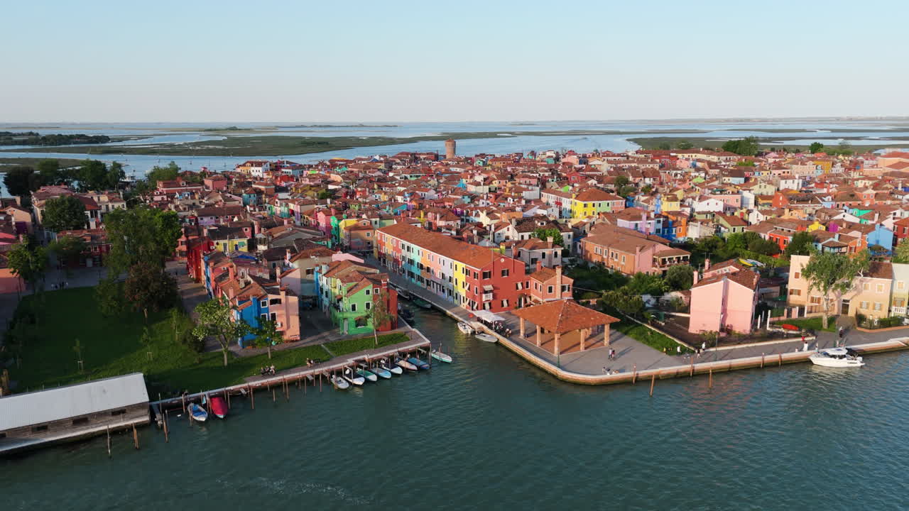 Boats Moored In The Burano Island In Venetian Lagoon, Italy. - aerial pullback shot