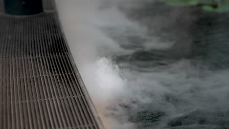 bubbling fog smoke gliding over water surface