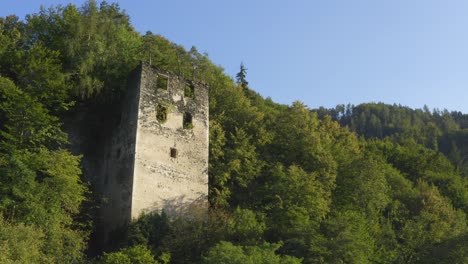 puchenstein castle tower ruin nestled in forest hills in dravograd, slovenia