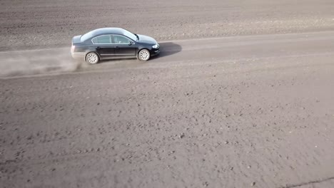 car driving on a dirt road