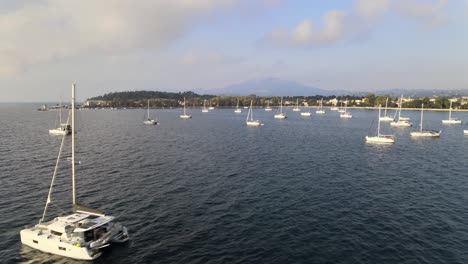 aerial view between anchored sailboats in an yacht harbor on corfu, greece
