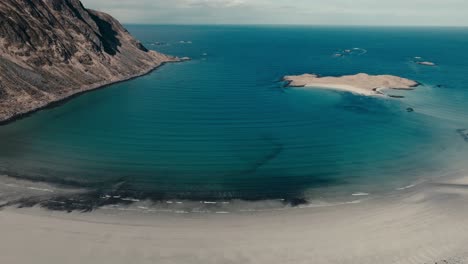 flying towards yttersand beach near roren-ytresandheia mountain hike in lofoten islands, norway