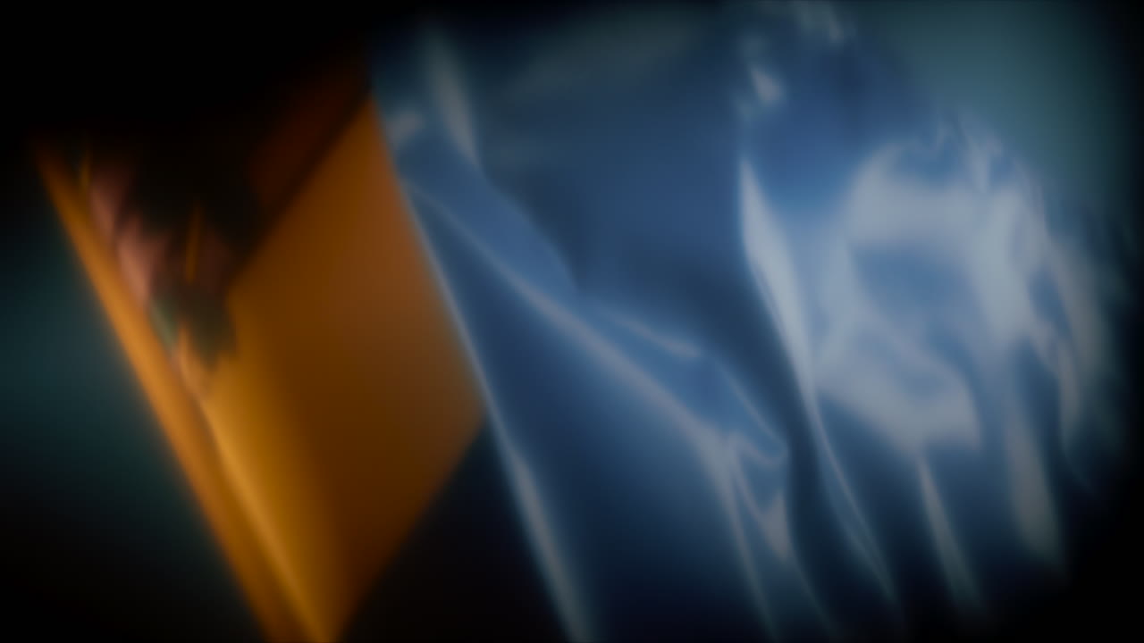 Soft focus close up of the Moldovan flag waving in the wind