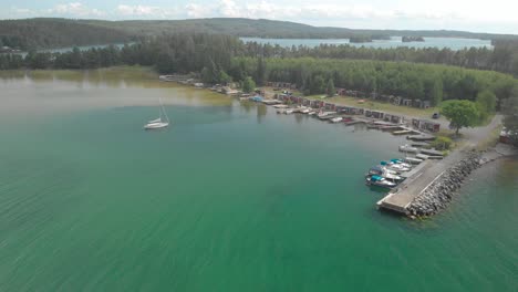 Aerial-view-of-harbour-with-boats-and-sail-boat