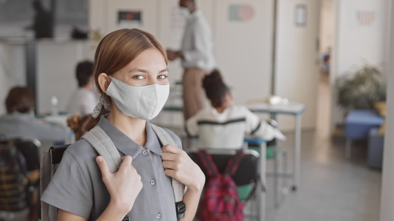 Portrait of Teenage School Girl in Face Mask at Class