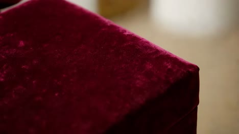 close-up of a maroon velvet gift box