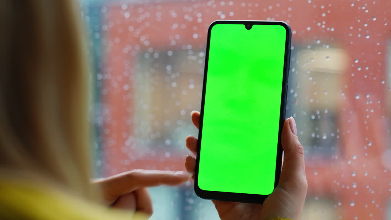 Lady hands swiping greenscreen cellphone choosing online purchases home closeup