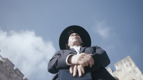 orthodox jewish man performing prayer