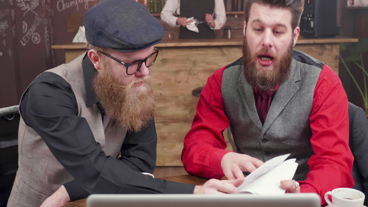 Men having a business meeting at the cafe