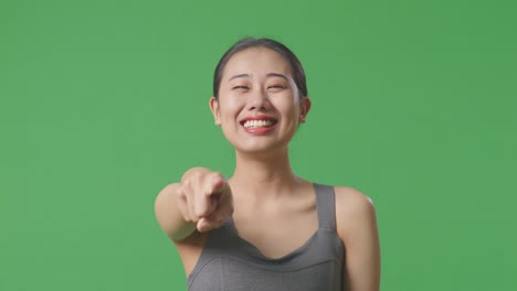 happy woman pointing at the camera