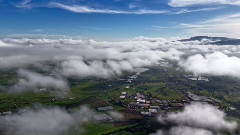 aerial hyperlapse, fast moving clouds above puebla