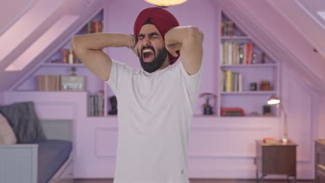 angry sikh indian man challenging someone for fight