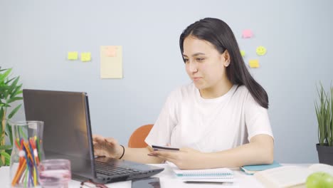 Female student doing e-commerce shopping.