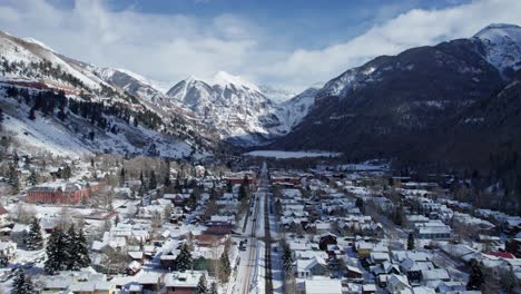 drone aerial flyover of telluride colorado down the center of town