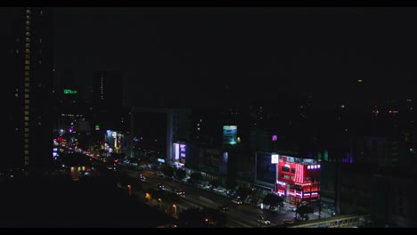 Lightning-Storm-Over-the-City-of-Bangkok-at-Night-with-Traffic-Flowing-in-Foreground