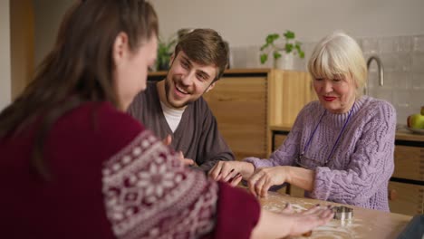 family making christmas cookies together