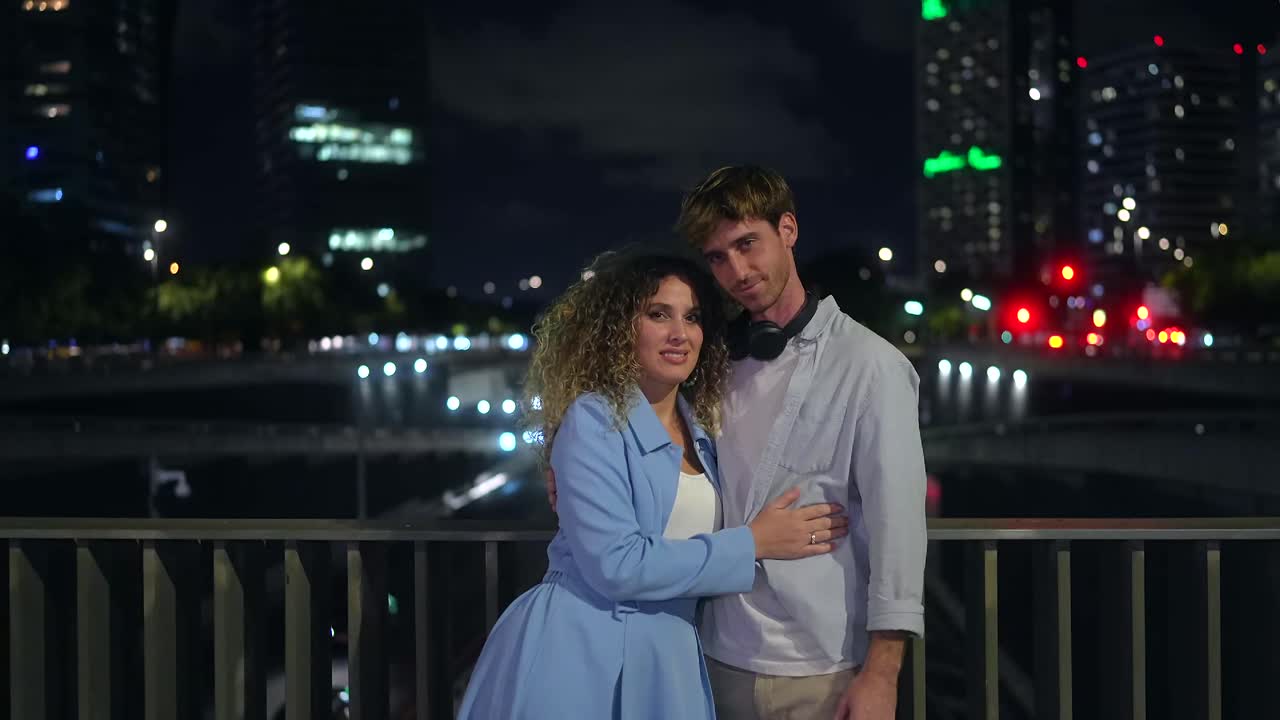 Couple Embracing at Night in the City
