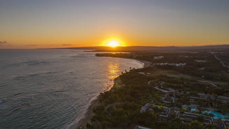 sun over the mountains in the beach, stunning caribbean aerial view with a clear sky