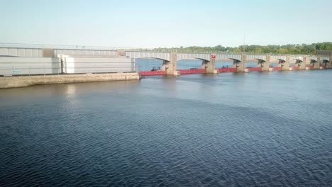 Drone-view-of-the-dike-and-moveable-portion-of-the-dam-of-Lock-and-Dam-14-on-the-Mississippi-River-consisting-of-tainter-and-4-roller-gates