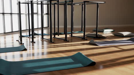 empty yoga and meditation studio with sunlight streaming in