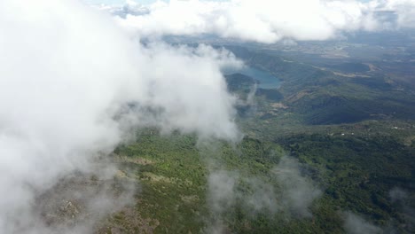 aerial view of coatepeque caldera lake in el salvador, surrounded by lush green landscape