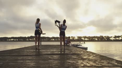 female rowing team training on a river