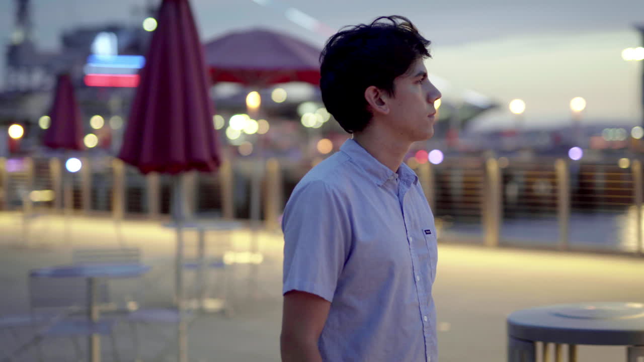 Man on a city street at night