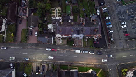 aerial footage of a street at night in a typical british town